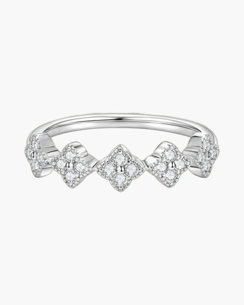 Sparkling women's silver 925 ring with five diamond-studded clover shapes on a light background