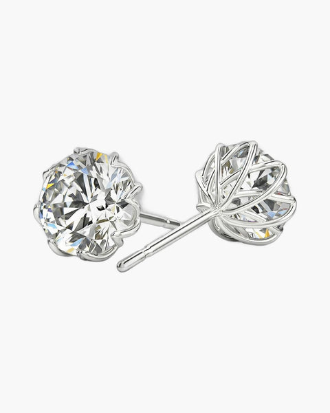 Sparkling round moissanite flower stud earrings in polished silver for women