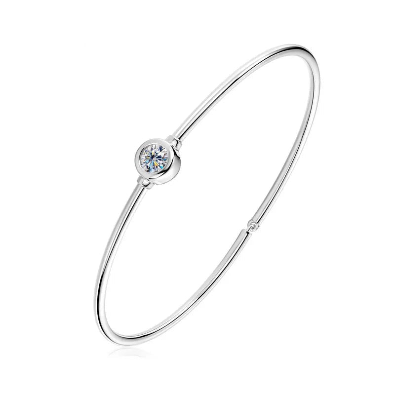 Minimalist women's silver 925 bangle bracelet with a single bezel-set round diamond