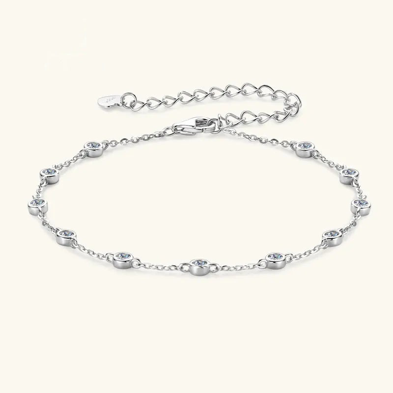 Elegant women's silver 925 bracelet with bezel-set cubic zirconia stones on a light background