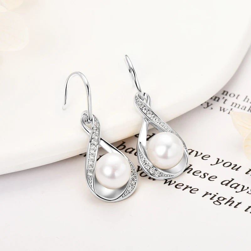Pearl And Cubic Zirconia Infinity Dangle Earrings
