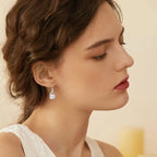 Pearl And Cubic Zirconia Infinity Dangle Earrings