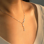 Asymmetrical Wave Drop Necklace with Pear-Shaped Zirconia