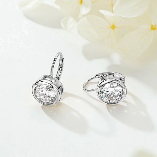 Silver 925 bezel set moissanite drop leverback earrings for women on a white background
