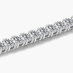 Close-up of a women's silver tennis bracelet with brilliant round cubic zirconia stones