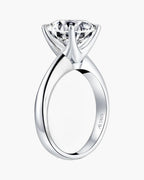 Sparkling round cut diamond set in a polished silver 925 women's engagement ring