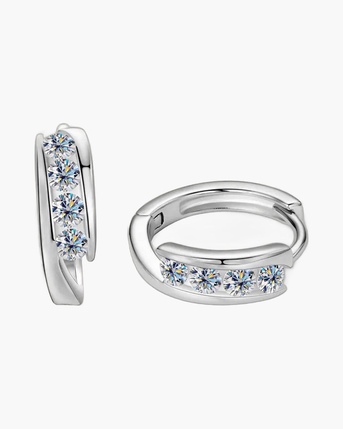 Two women's silver huggie hoop earrings with five round brilliant-cut moissanite stones each