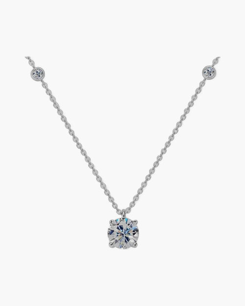 Women's silver 925 necklace with a large round solitaire pendant and two smaller accent stones