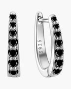 Pair of women's silver 925 hoop earrings with a line of black gemstones