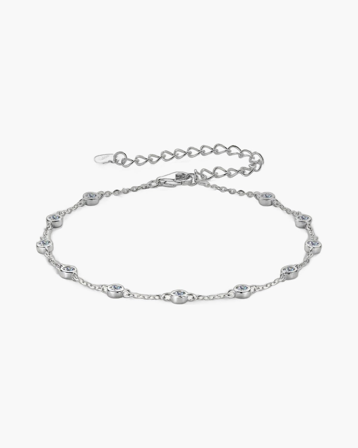 Elegant women's silver 925 bracelet with bezel-set cubic zirconia stones on a light background