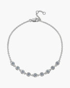 Dainty women's silver 925 bracelet with round bezel-set cubic zirconia stones and lobster clasp