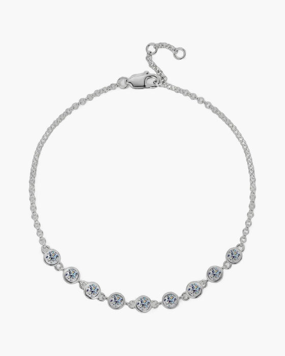 Dainty women's silver 925 bracelet with round bezel-set cubic zirconia stones and lobster clasp