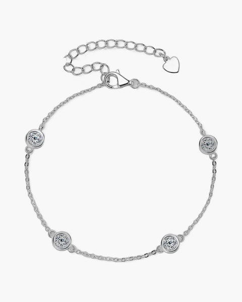 Women's silver 925 bracelet with bezel-set round moissanite stones and heart charm