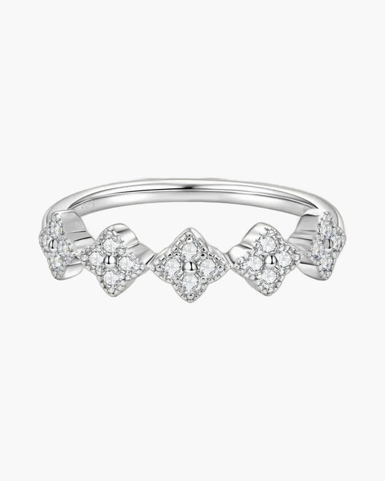Sparkling women's silver 925 ring with five diamond-studded clover shapes on a light background