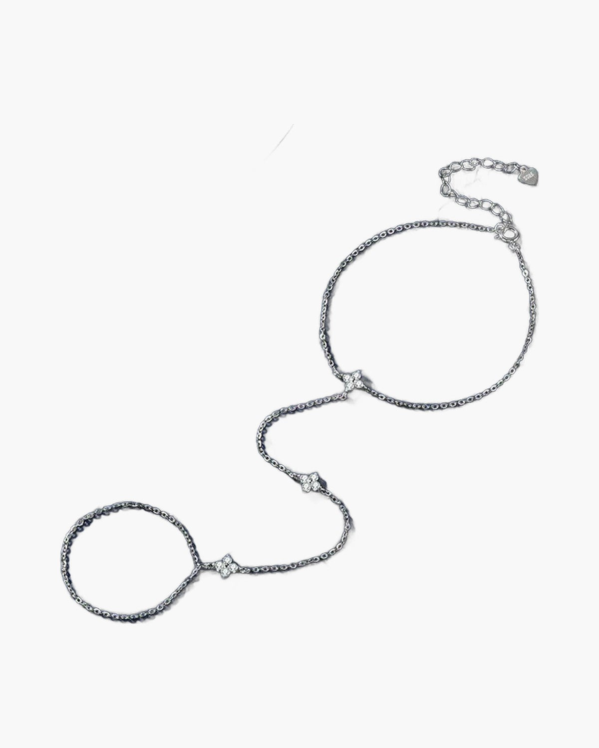 Elegant women's silver 925 hand chain with delicate clover charms on a blue background