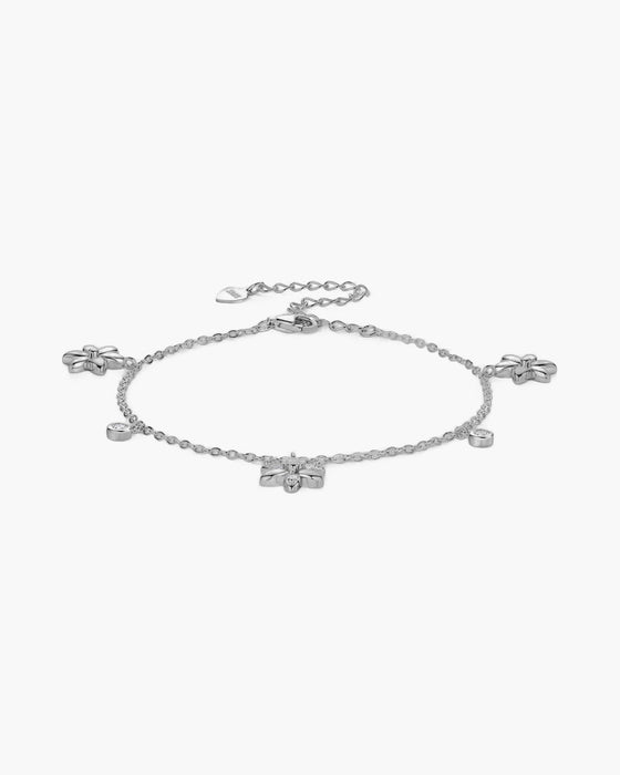 Women's silver 925 bracelet with delicate chain, flower charms, and round bezel-set stones