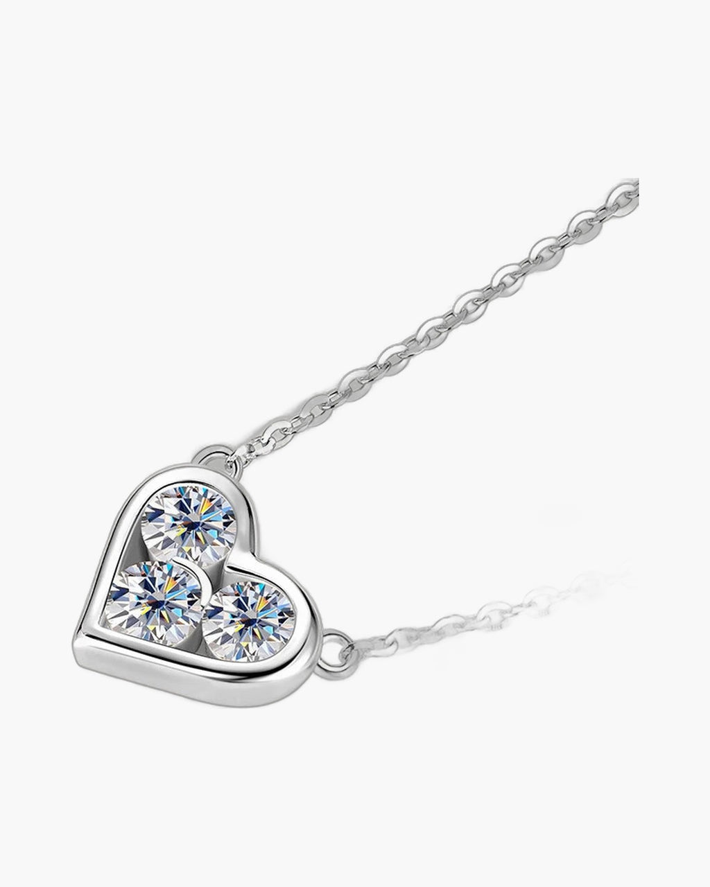 Women's polished silver heart pendant with three sparkling round cut cubic zirconia stones