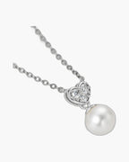 Women's silver 925 necklace with heart-shaped pendant, clear stones, and single pearl drop