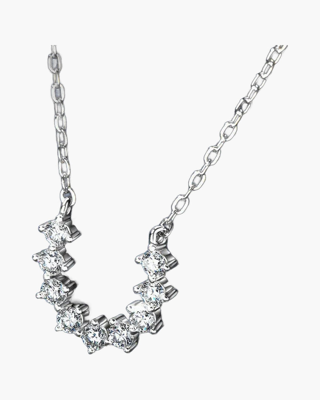 Women's delicate silver 925 necklace with sparkling cubic zirconia stones on a blue background
