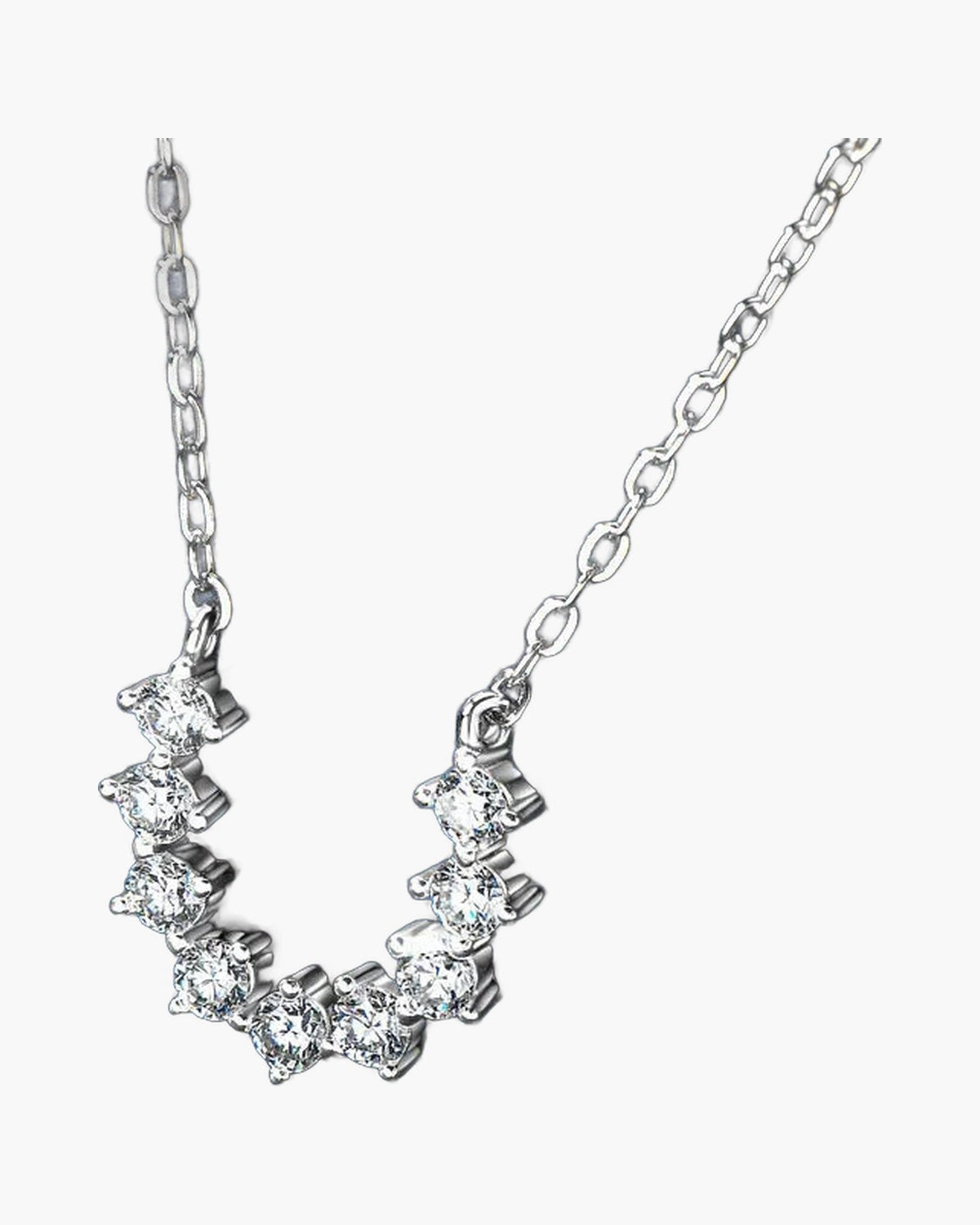 Women's delicate silver 925 necklace with sparkling cubic zirconia stones on a blue background