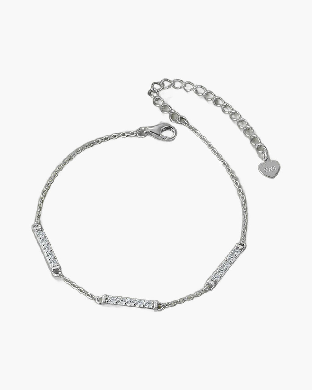 Delicate women's silver 925 bracelet with sparkling cubic zirconia bar links on green surface