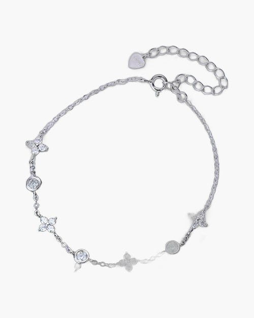 Delicate women's silver 925 bracelet with sparkling cubic zirconia flowers and round stones