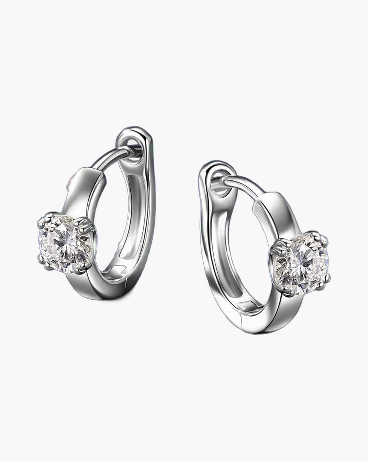 Pair of women's silver huggie hoop earrings with a single round moissanite stone
