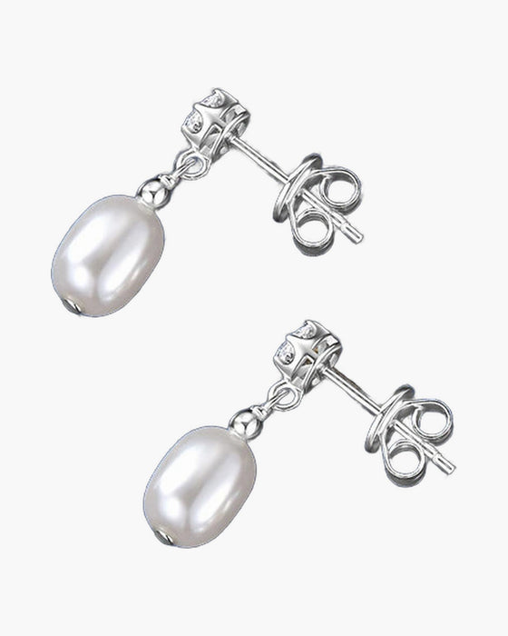 Elegant women's silver 925 stud earrings with dangling white freshwater pearls on blue fabric
