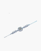 Sparkling women's silver bracelet with a large central diamond and smaller accent stones