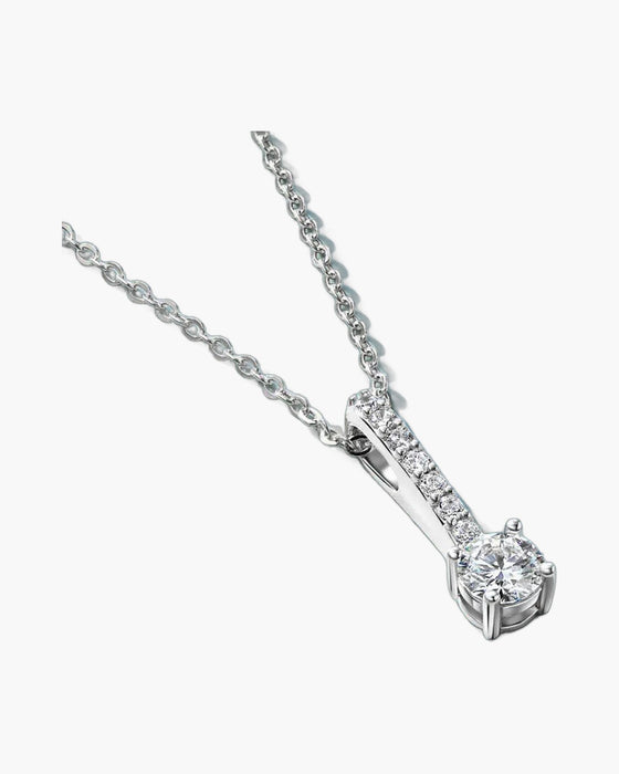 Women's silver 925 necklace with sparkling round diamond pendant on a blue background