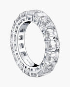 Sparkling women's silver eternity band ring with emerald cut cubic zirconia stones