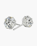 Sparkling round moissanite flower stud earrings in polished silver for women