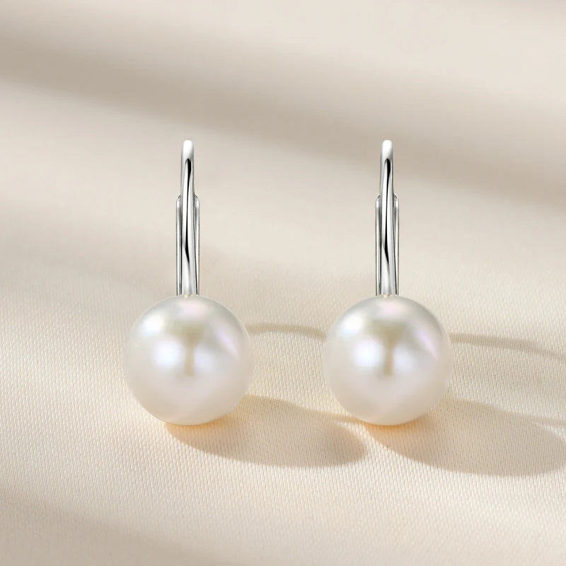 Elegant women's silver 925 leverback earrings with lustrous white round pearls