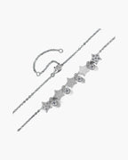 Sparkling silver 925 women's bracelet with star and round cubic zirconia charms on blue background