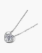 Women's silver 925 heart pendant necklace with a sparkling round diamond on blue background