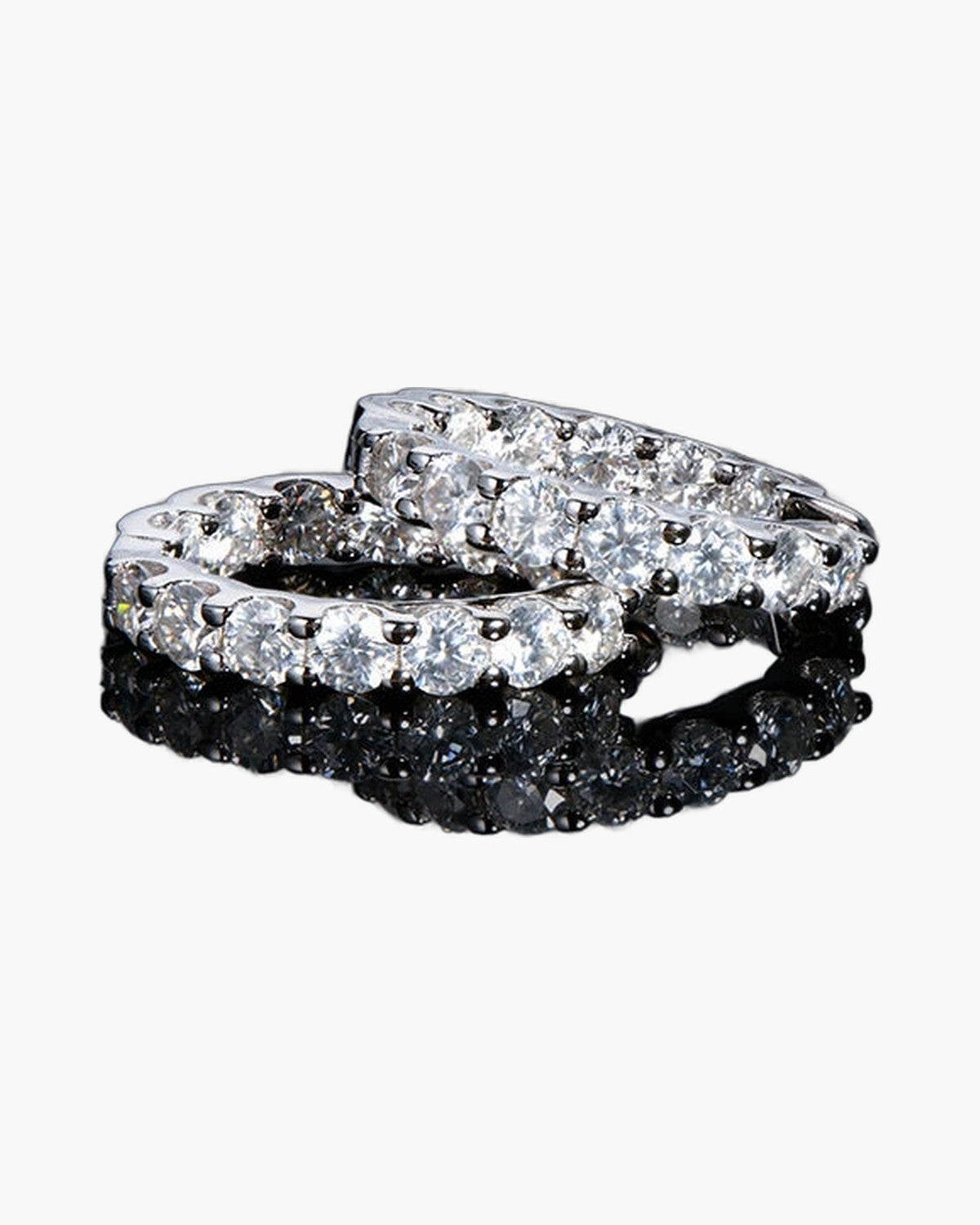 Two sparkling women's silver 925 eternity rings with brilliant round cut diamonds