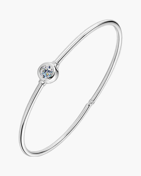 Minimalist women's silver 925 bangle bracelet with a single bezel-set round diamond