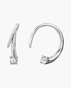 Elegant women's silver 925 hoop earrings with sparkling solitaire cubic zirconia on blue background
