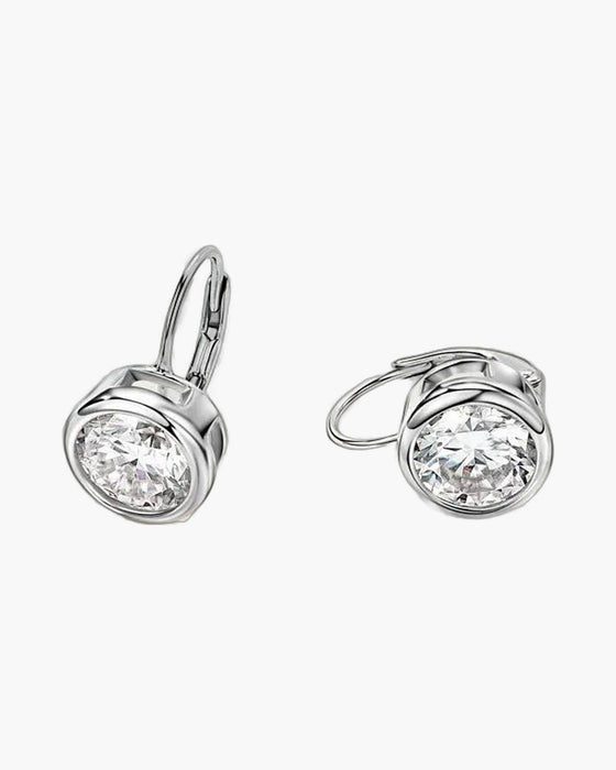 Silver 925 bezel set moissanite drop leverback earrings for women on a white background