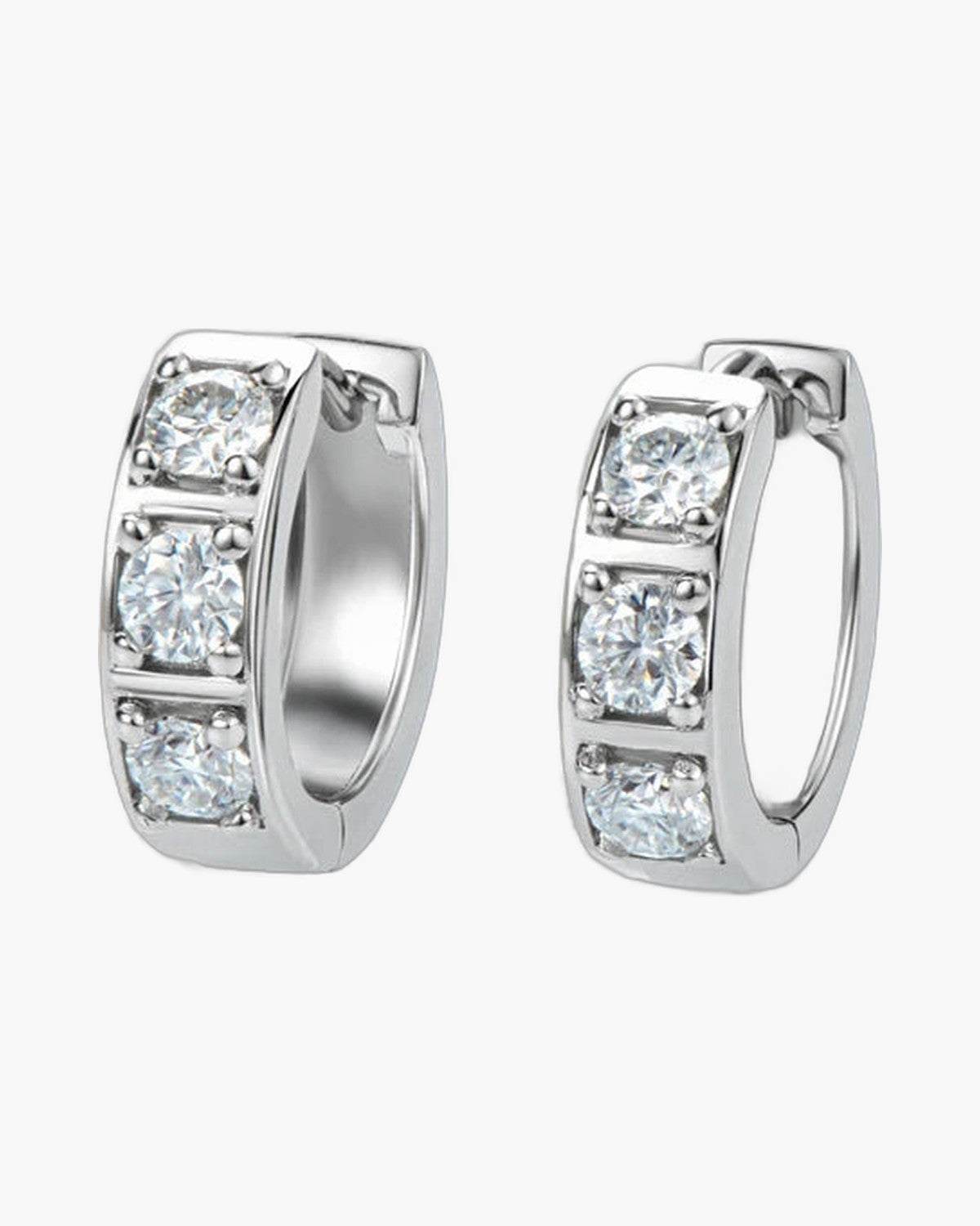 Pair of women's silver hoop earrings with three sparkling round cubic zirconia stones