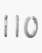 Three women's silver 925 ear cuffs, one plain, one twisted, one with zircons