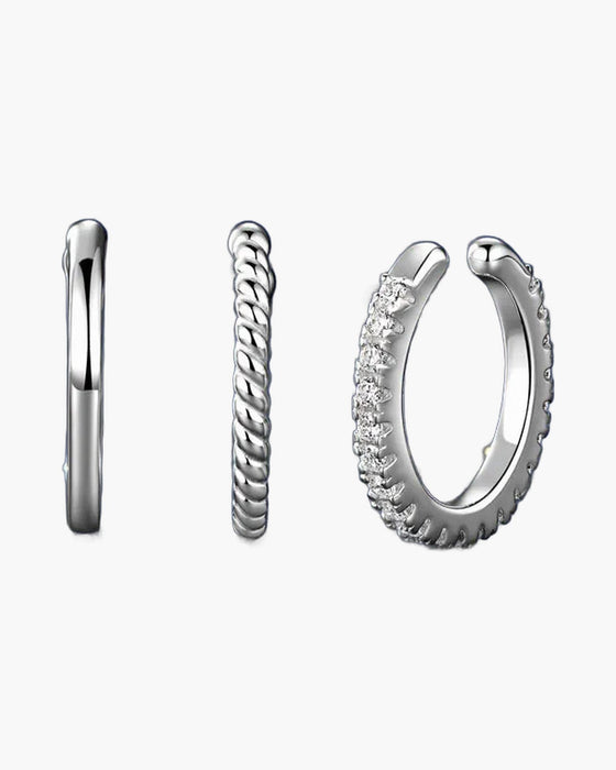 Three women's silver 925 ear cuffs, one plain, one twisted, one with zircons