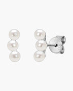 Elegant women's silver 925 stud earrings featuring three delicate white pearls in a row