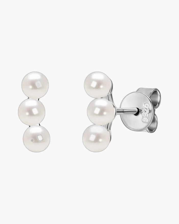 Elegant women's silver 925 stud earrings featuring three delicate white pearls in a row