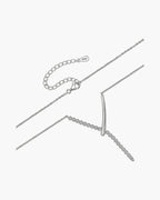 Elegant women's silver 925 necklace with a curved bar pendant and sparkling cubic zirconia stones